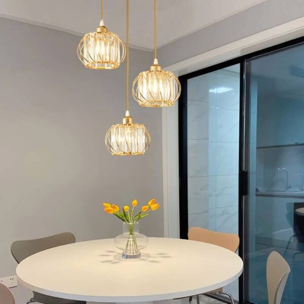 Suspension luminaire sphérique en métal aux reflets dorés
